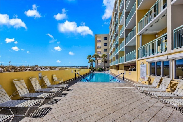 view of swimming pool with a patio area