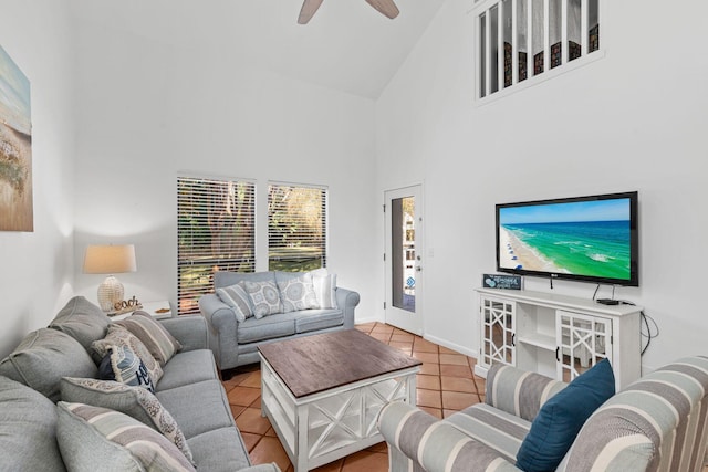 living room featuring ceiling fan, light tile patterned flooring, and high vaulted ceiling