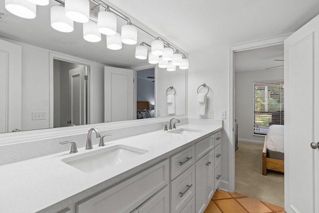 bathroom featuring tile patterned flooring and vanity