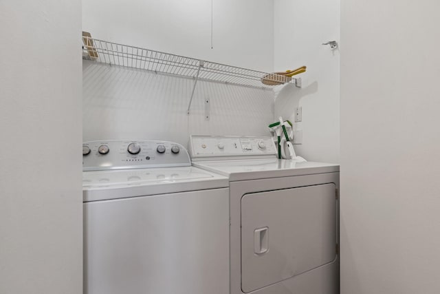 laundry area with separate washer and dryer