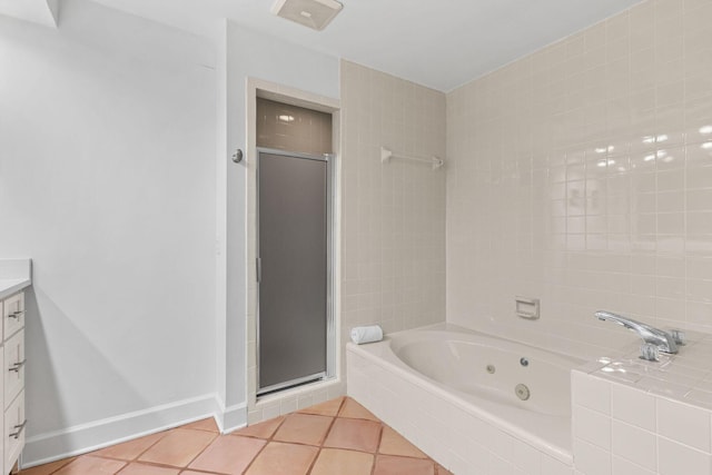 bathroom with tile patterned flooring, vanity, and plus walk in shower