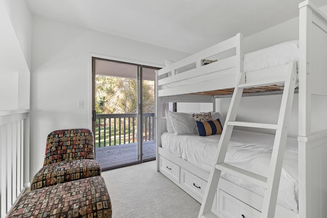 bedroom featuring access to outside and light colored carpet