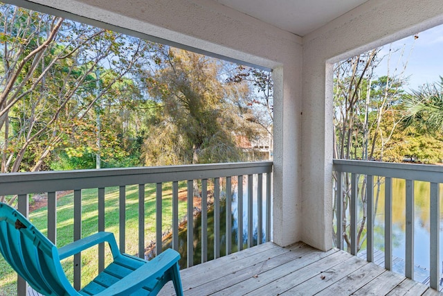 deck featuring a water view