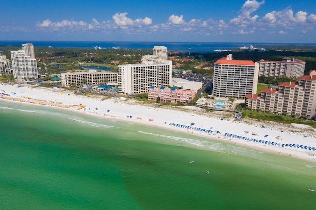 birds eye view of property with a water view and a view of the beach