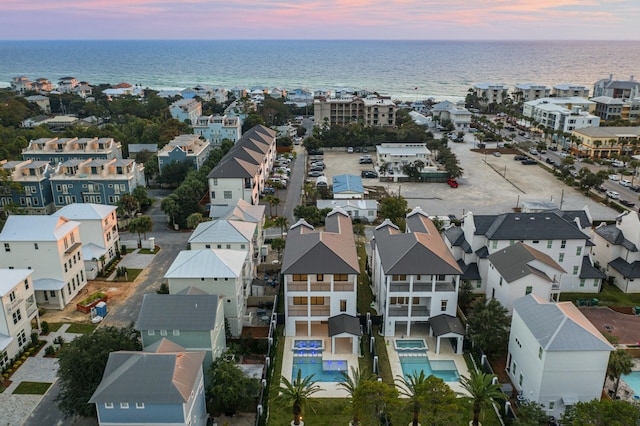 aerial view at dusk with a water view