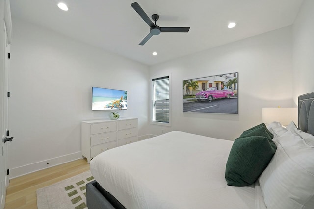 bedroom featuring ceiling fan and light hardwood / wood-style floors