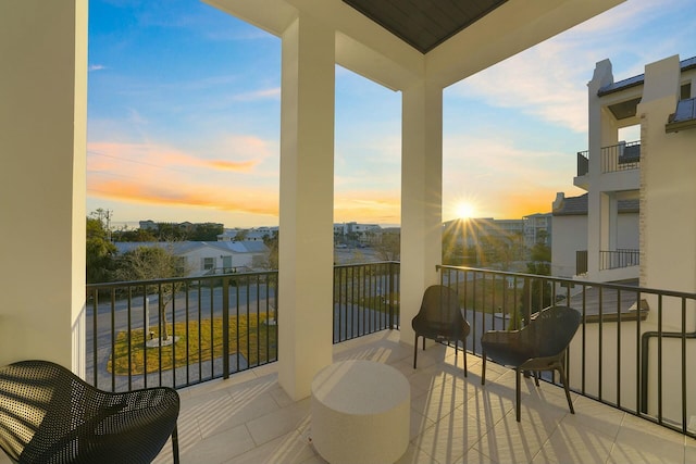 view of balcony at dusk