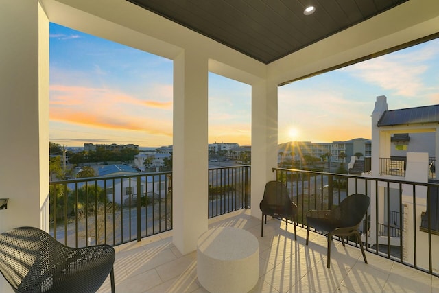 view of balcony at dusk