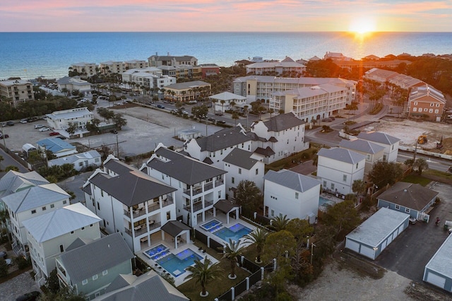 aerial view at dusk with a water view