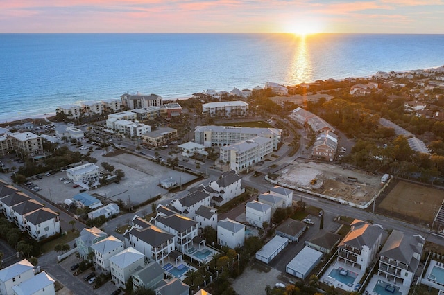 aerial view at dusk with a water view