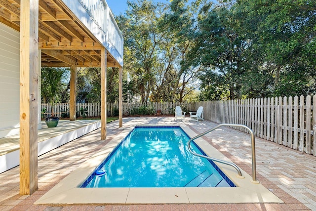 view of swimming pool with a patio