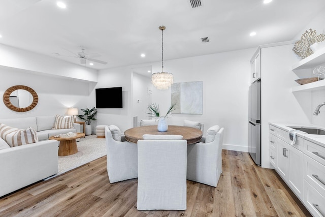 34 Buddy St, Santa Rosa Beach, FL 32459 - dining room with recessed lighting, ceiling fan, light wood finished floors, and a chandelier