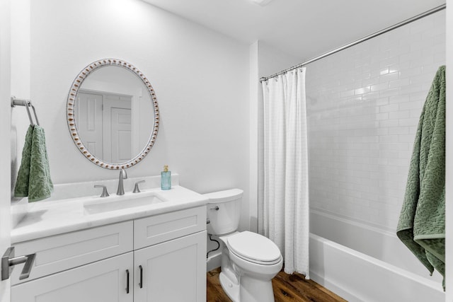 full bathroom with hardwood / wood-style flooring, vanity, toilet, and shower / bath combo with shower curtain