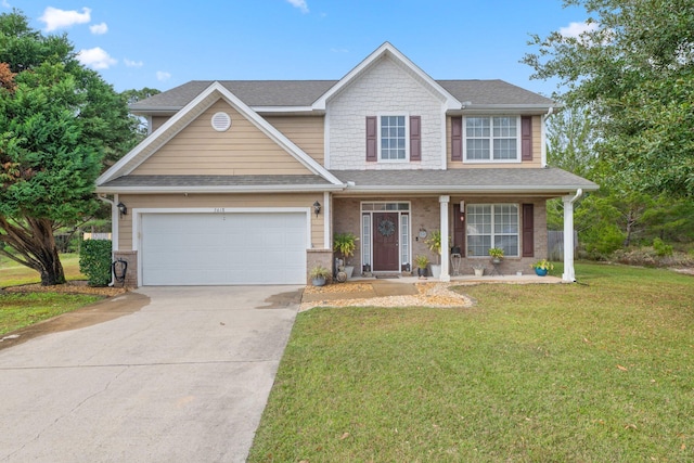 view of front facade featuring a porch, a garage, and a front lawn