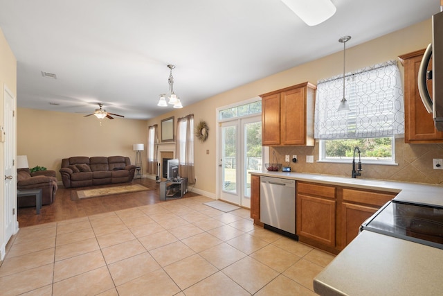 kitchen with tasteful backsplash, pendant lighting, and appliances with stainless steel finishes