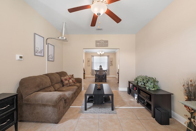 living room with light tile patterned floors and ceiling fan with notable chandelier