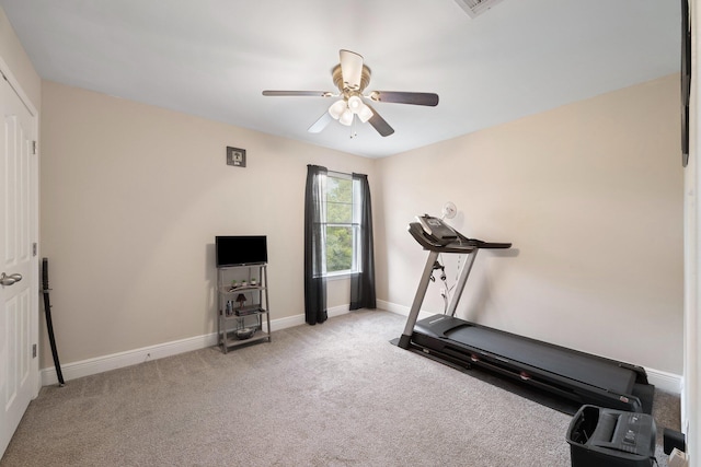 workout area with ceiling fan and light colored carpet