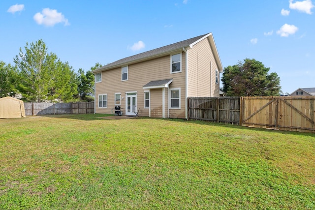 rear view of house with a yard