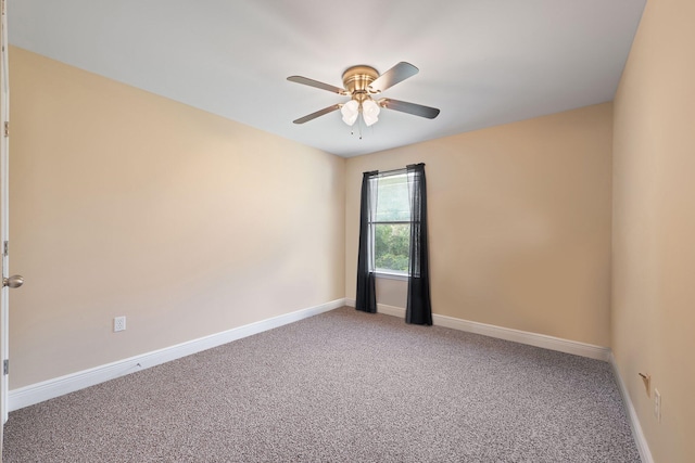 empty room featuring carpet flooring and ceiling fan