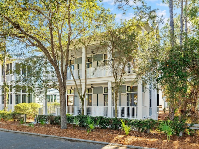 view of front of house with covered porch and a balcony