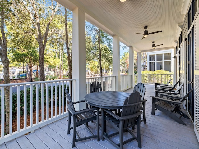 wooden terrace featuring ceiling fan