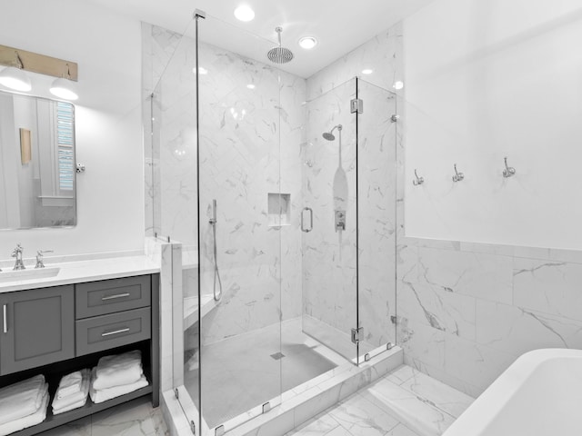 bathroom with vanity, tile walls, and plus walk in shower