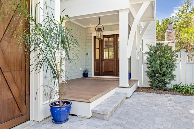 doorway to property featuring a porch