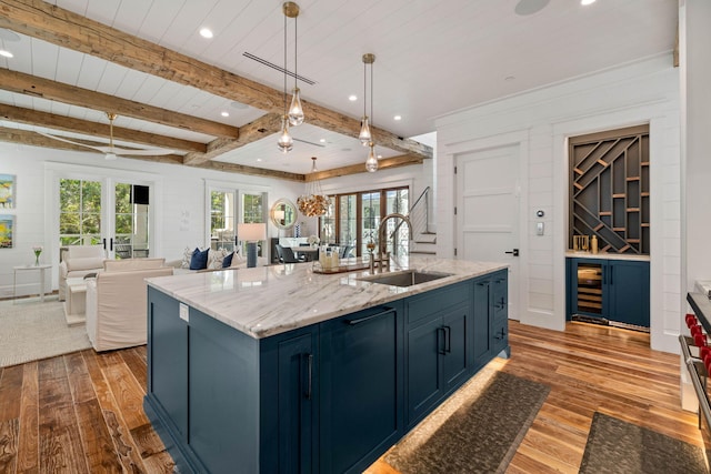 kitchen with plenty of natural light, light hardwood / wood-style floors, and french doors