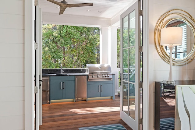 doorway featuring ceiling fan, dark wood-type flooring, sink, wooden ceiling, and wine cooler