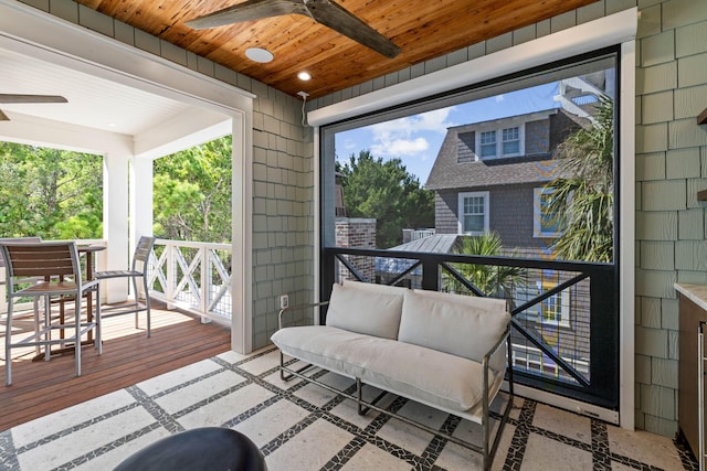 exterior space with ceiling fan and wooden ceiling