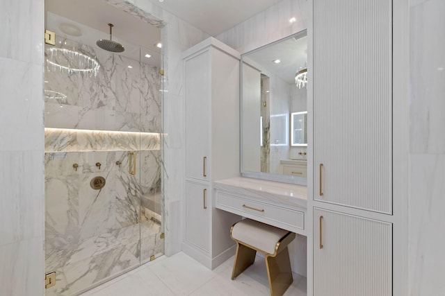 bathroom featuring tile patterned floors, vanity, and an enclosed shower