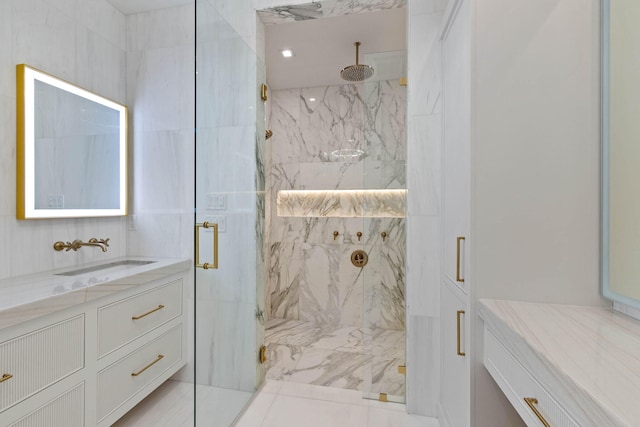 bathroom with vanity and a shower with shower door