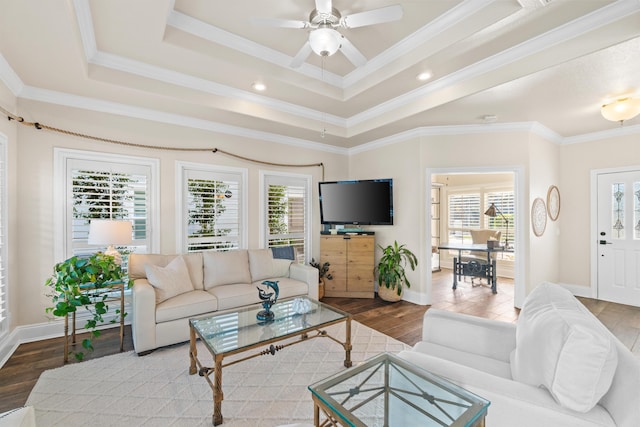 living room with a healthy amount of sunlight and ornamental molding