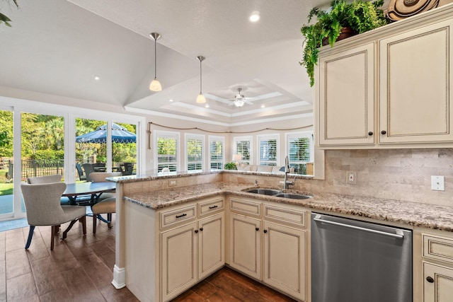 kitchen featuring ceiling fan, sink, stainless steel dishwasher, and cream cabinetry