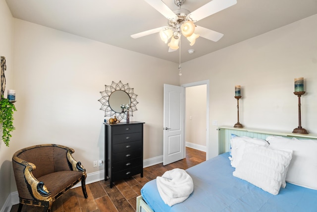 bedroom featuring ceiling fan and dark wood-type flooring