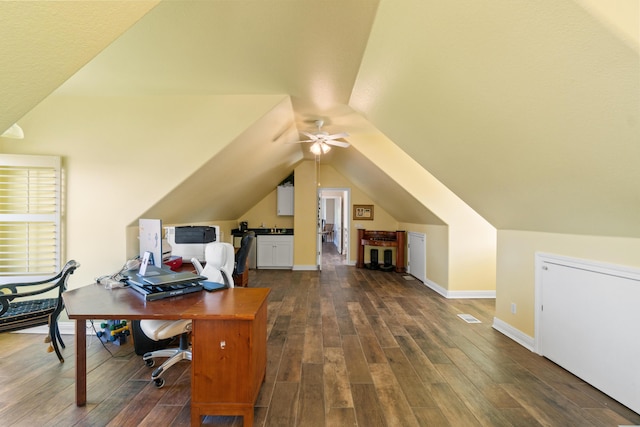 office area with ceiling fan, dark hardwood / wood-style flooring, and vaulted ceiling