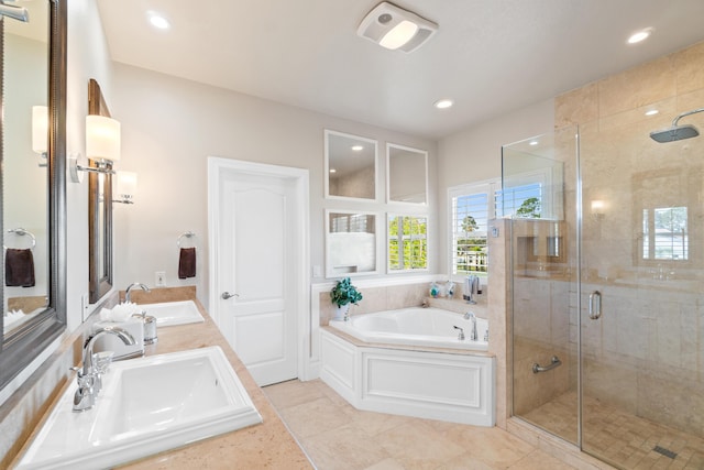 bathroom with separate shower and tub, tile patterned flooring, and vanity