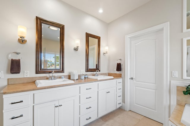 bathroom featuring tile patterned floors and vanity