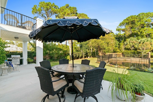 view of patio with a balcony and grilling area