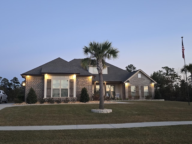 view of front of house with a lawn