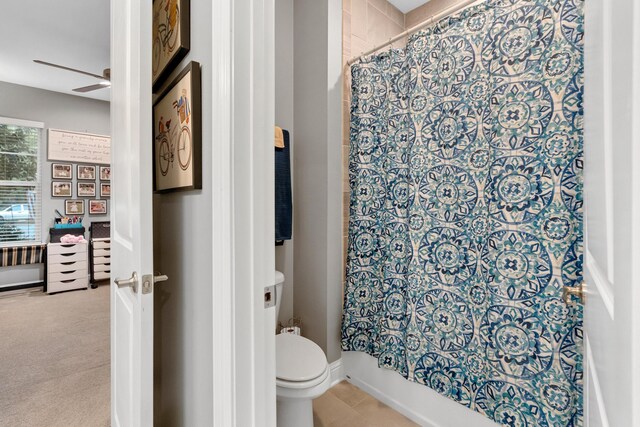 bathroom featuring toilet and ceiling fan