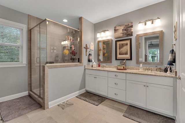 bathroom with tile patterned flooring, vanity, and an enclosed shower