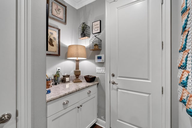 doorway to outside featuring ornamental molding