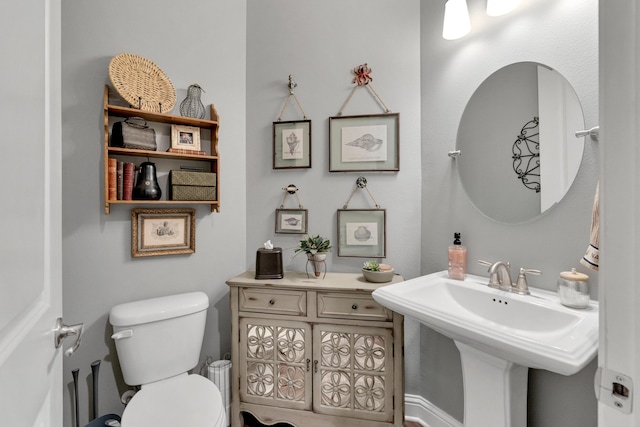 bathroom with toilet and sink