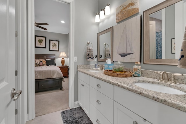 bathroom with tile patterned floors, ceiling fan, and vanity