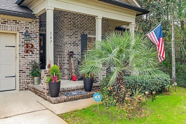 view of exterior entry featuring a garage