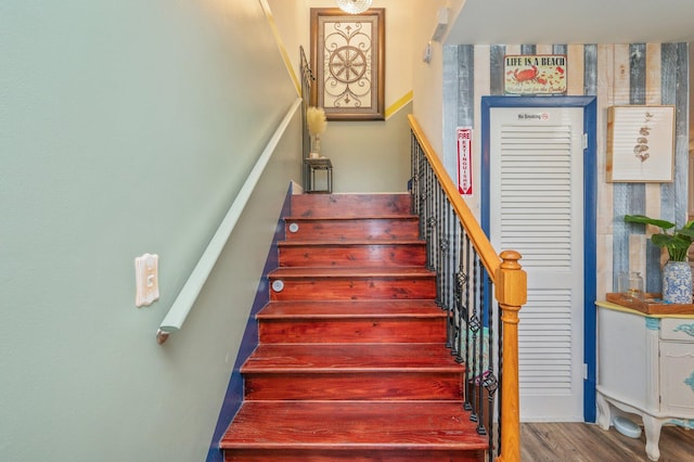 stairway featuring hardwood / wood-style flooring