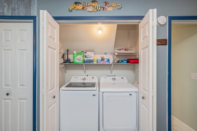 clothes washing area featuring washing machine and clothes dryer