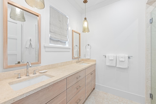 bathroom with vanity, an enclosed shower, and ornamental molding