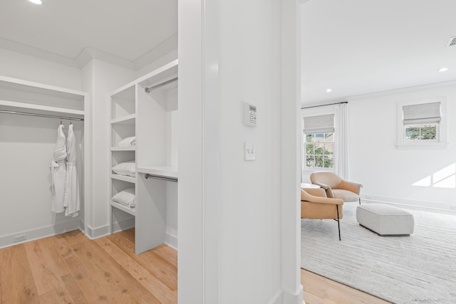 walk in closet featuring hardwood / wood-style floors